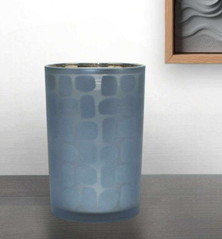 Stylish blue candle holder with a contemporary pattern, perfect for creating a chic vibe in any room.