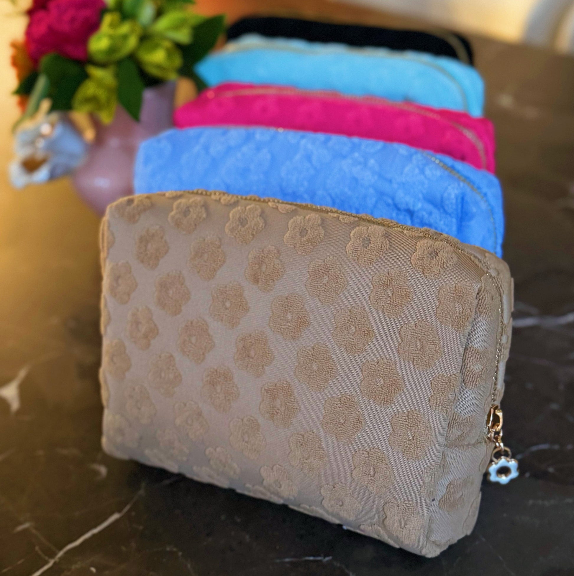 Get Glam with Our Embossed Daisy Blossom Cosmetic Case! 🌼✨