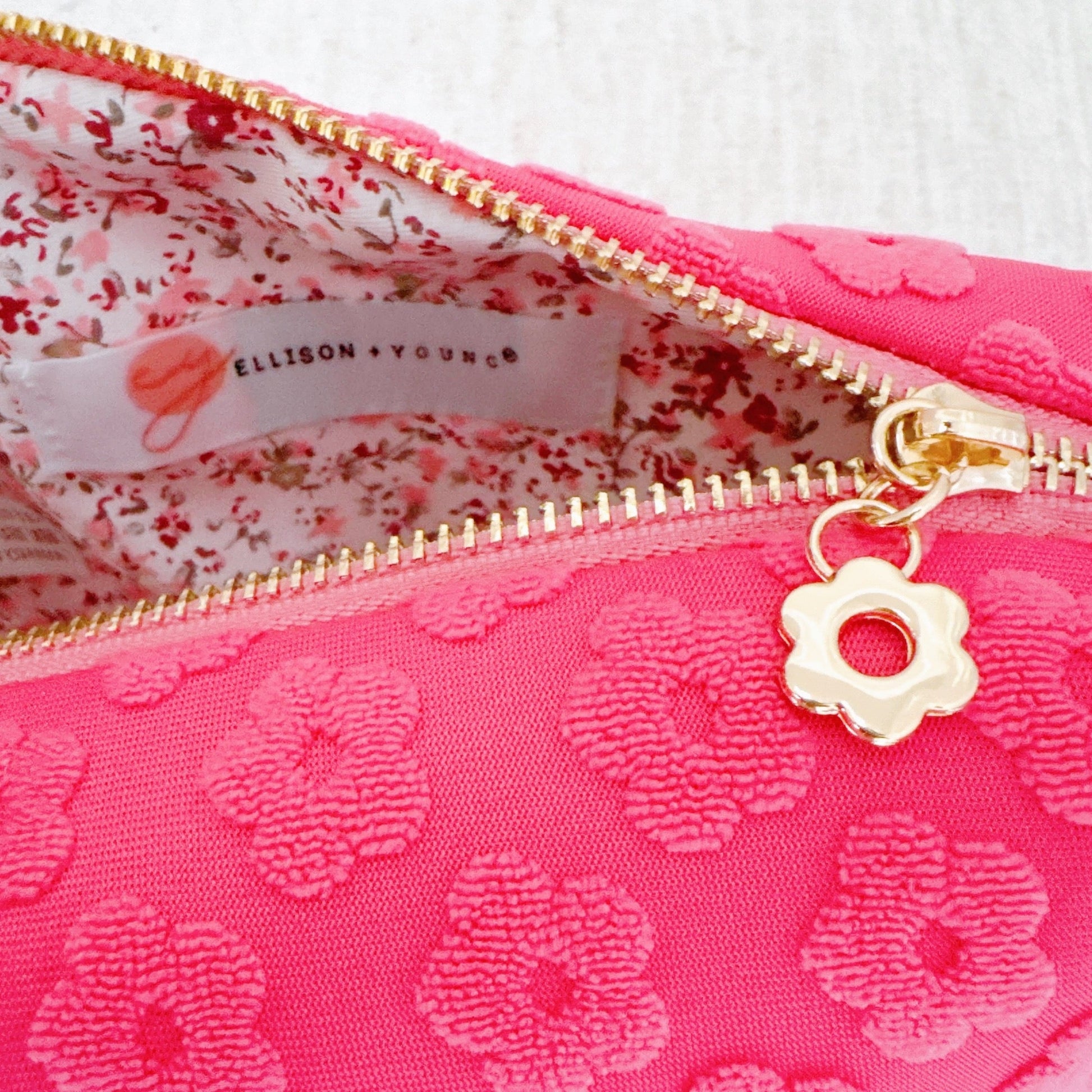 Get Glam with Our Embossed Daisy Blossom Cosmetic Case! 🌼✨