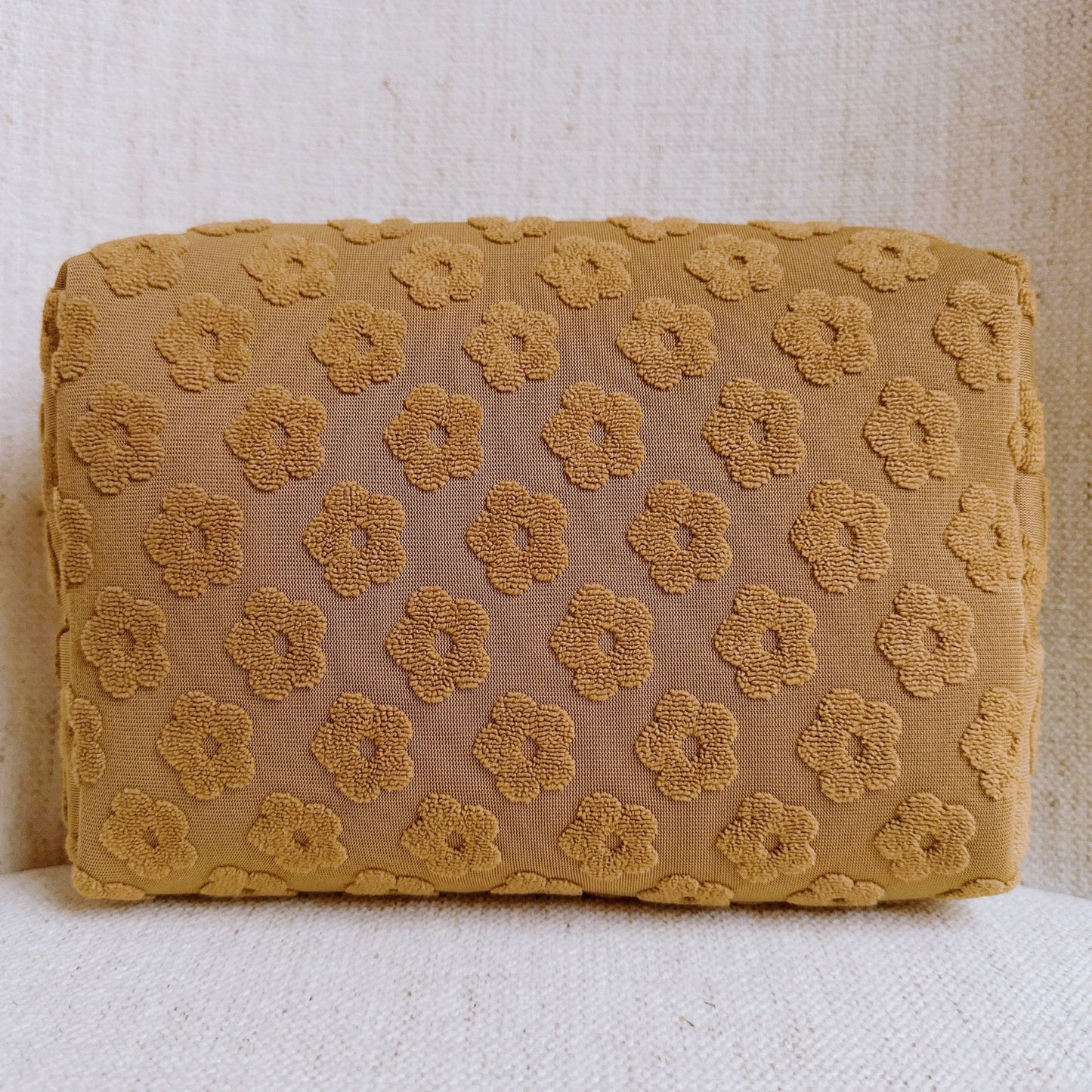 Get Glam with Our Embossed Daisy Blossom Cosmetic Case! 🌼✨