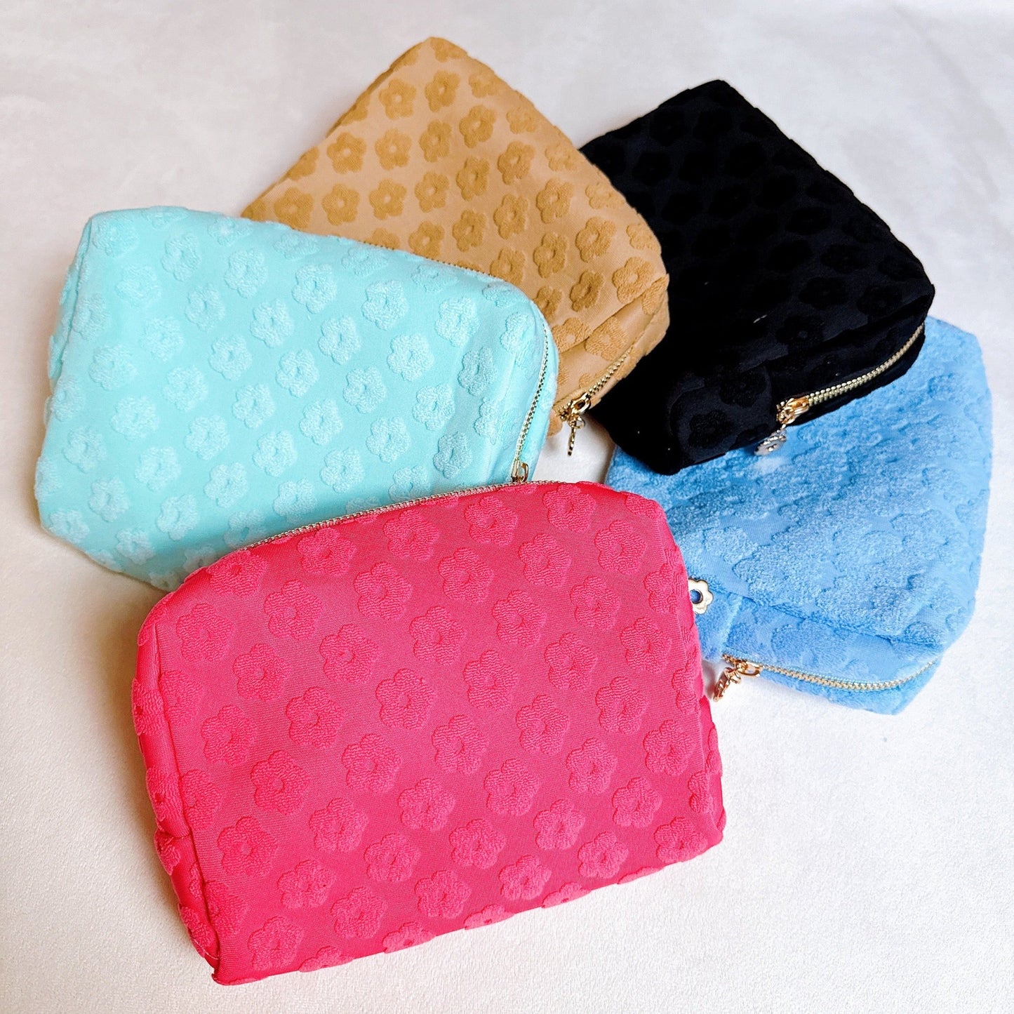 Get Glam with Our Embossed Daisy Blossom Cosmetic Case! 🌼✨