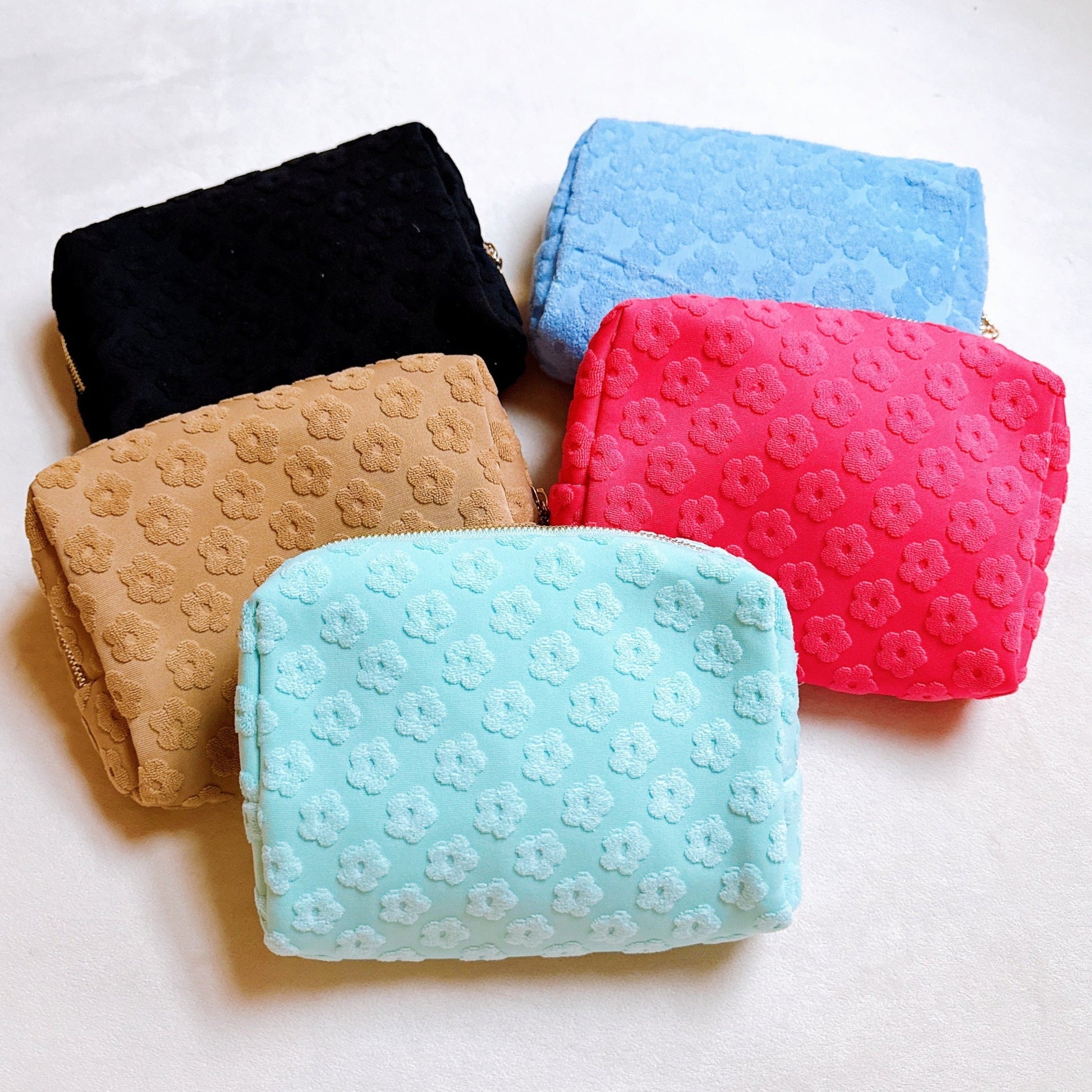 Get Glam with Our Embossed Daisy Blossom Cosmetic Case! 🌼✨