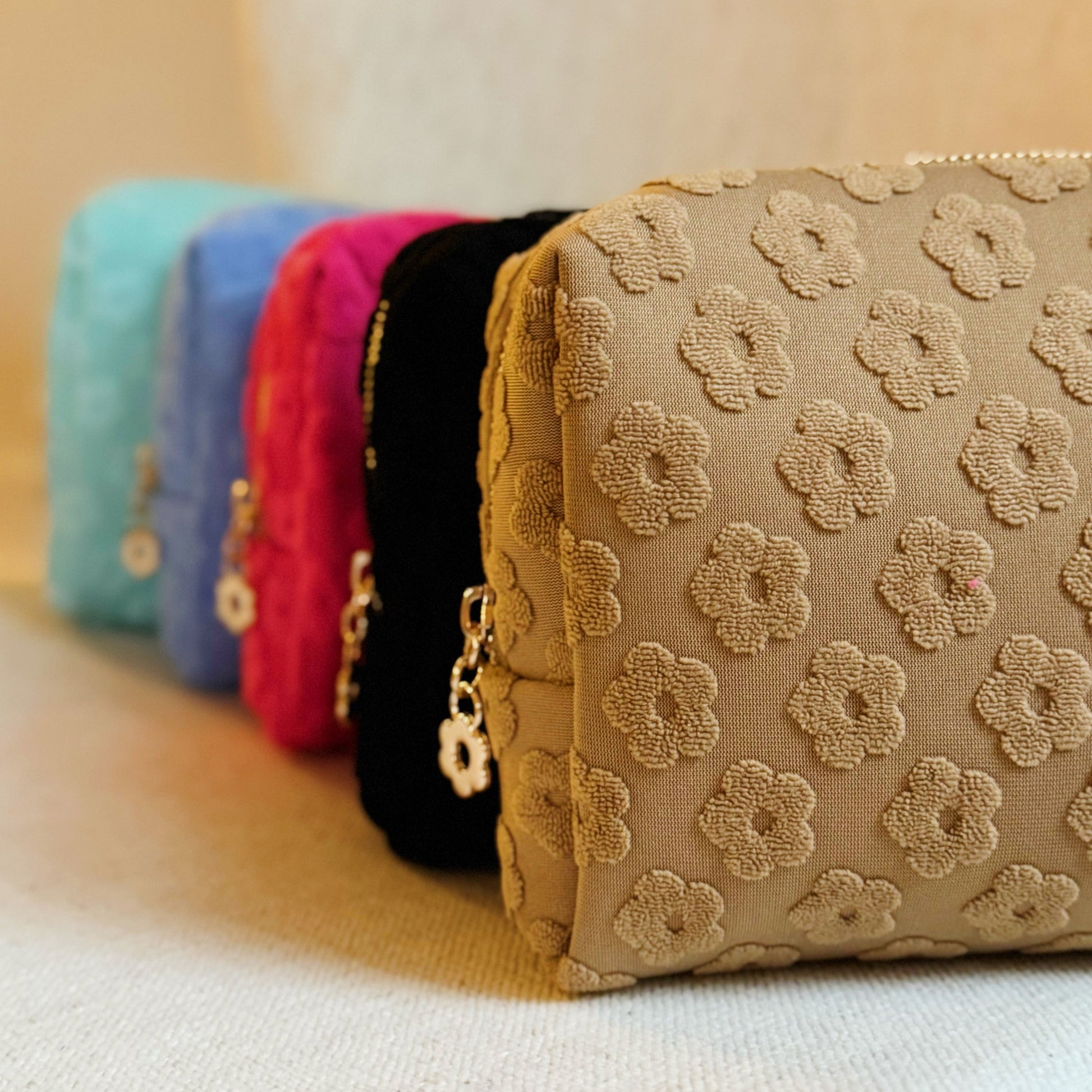 Get Glam with Our Embossed Daisy Blossom Cosmetic Case! 🌼✨